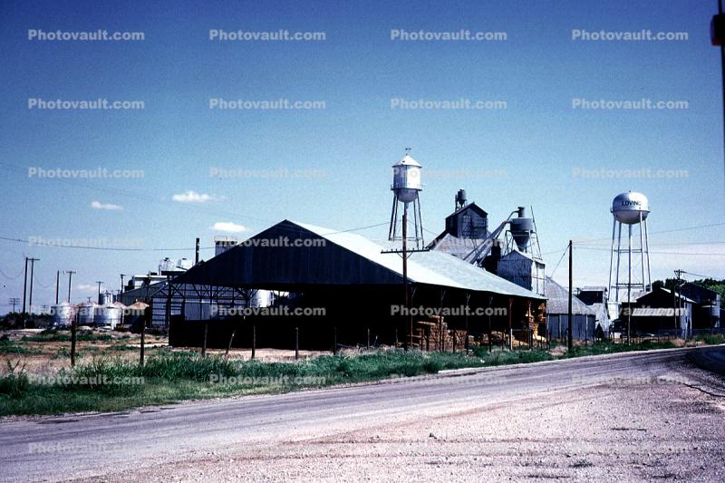 Warehouse, Road, Water Towers, Loving, Texas, June 1972, 1970s