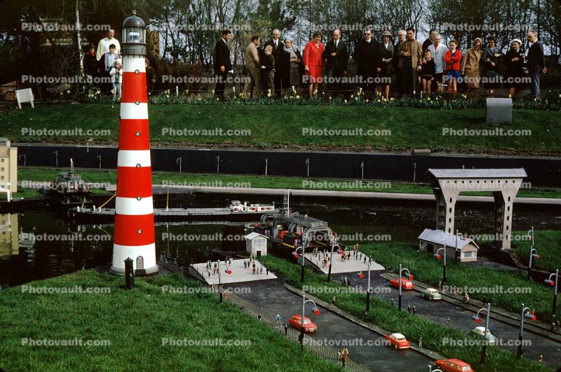 Lighthouse, cars, ferry landing, boat, Miniature park, Madurodam, Scheveningen district of The Hague, Netherlands, April 1968, 1960s