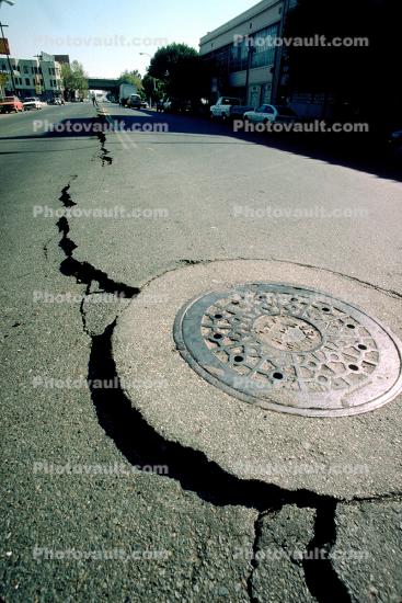 Crack Opens Up from Soil Liquefaction, Manhole Cover