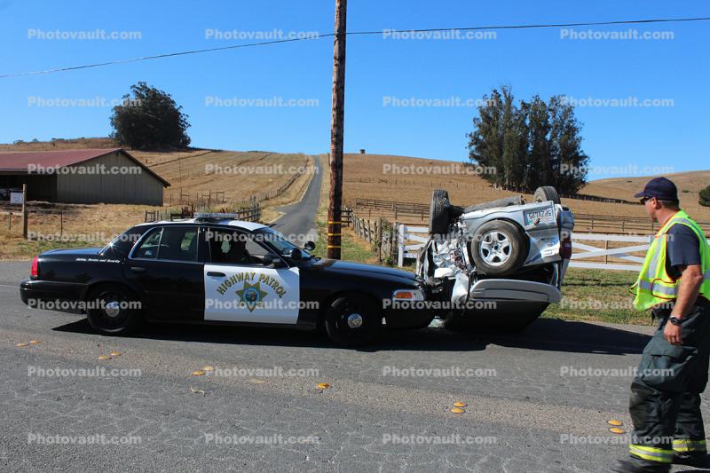 California Highway Patrol pushing and overturned car off the road, CHP, Sonoma County