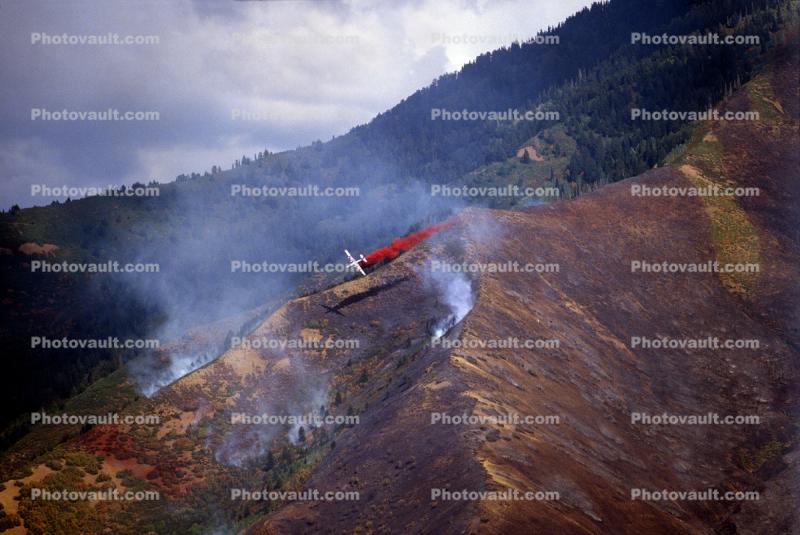 Convair PB4Y-2 Privateer, dropping fire retardent on a mountain forest fire