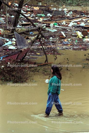 Woman walking in the flood, 15 January 1995