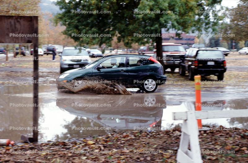 Car splashing in the muddy water