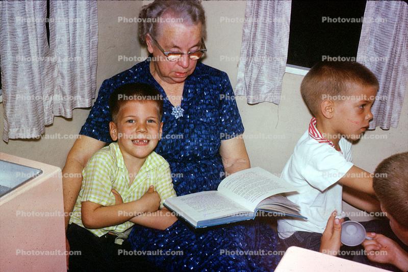 Grandma reading to grandchildren, 1950s