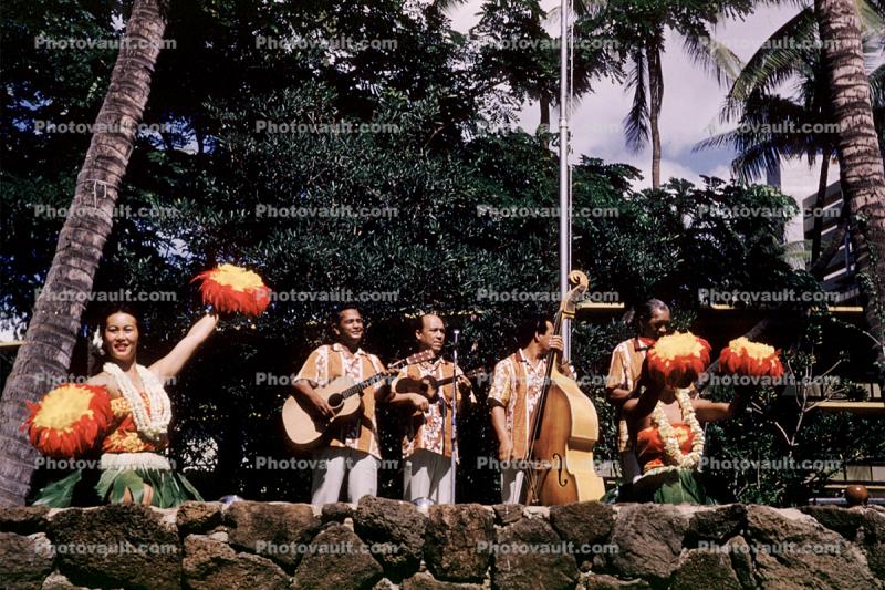 Guitar, Bass Fiddle, pom poms, lei, woman, men, lava rocks, October 1960, 1960s