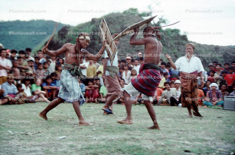 War Dance, Sparing, Shields, Audience, Native Costume, West Nusa Tenggara province, (Nusa Tenggara Barat, NTB), Lesser Sunda Islands, Indonesia, Spectators