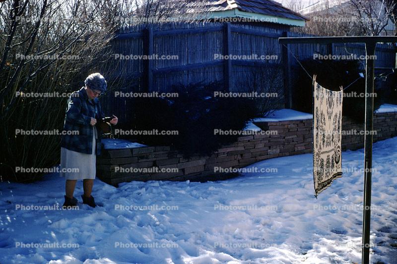 Woman, backyard, snow covered