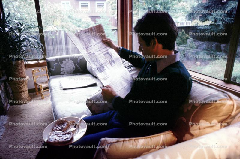 Man reads the morning newspaper