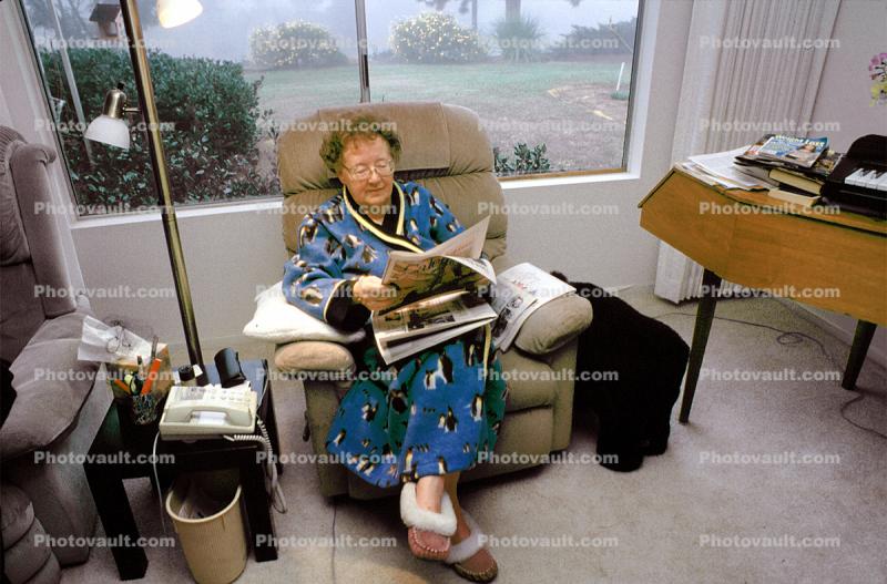 Woman reading the morning newspaper