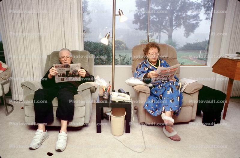 Couple reading the morning newspaper