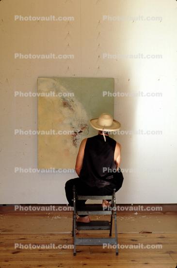 Woman Sitting, hat, veiwing artwork