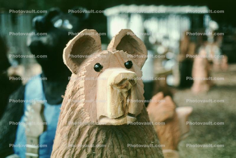 wooden bear face sculpture