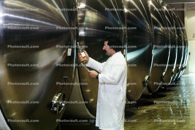 Vintner checking sugar content, Fermentation Tanks, Aluminum, Aluminum Aging barrels, Metal, Aluminum Barrels, Fermenting