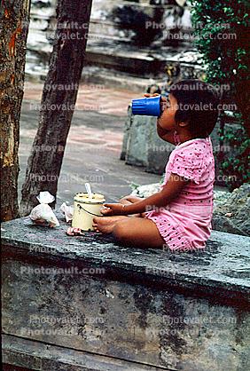 Girl Drinking from Cup, Table