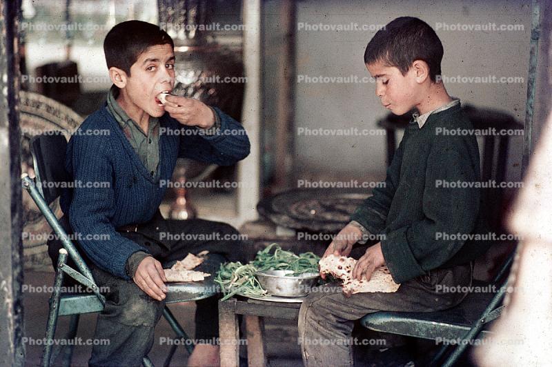 Boys eating, Isfahan