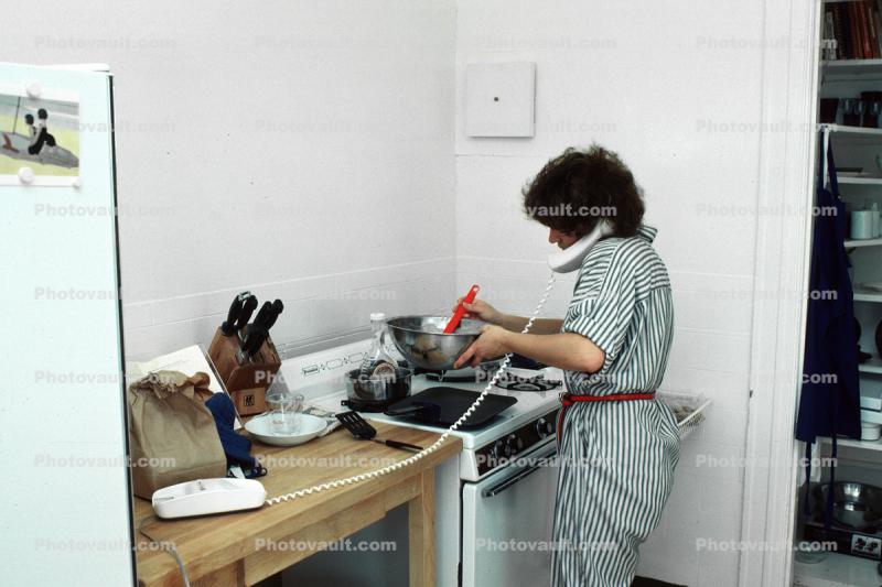 Stove, Woman talking on the phone cooking, frying pan, knives, 1980s