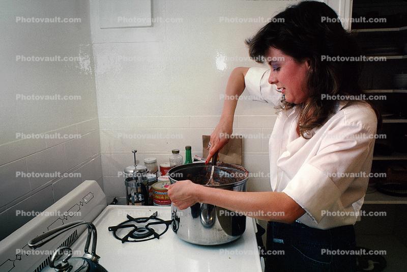 Woman Cooking in Kitchen