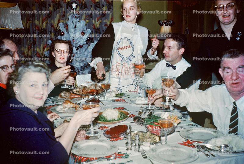 Wine Toast at Holiday Dinner, Hostess, Apron, Women, Men, couples, Mouth full, Table Cloth