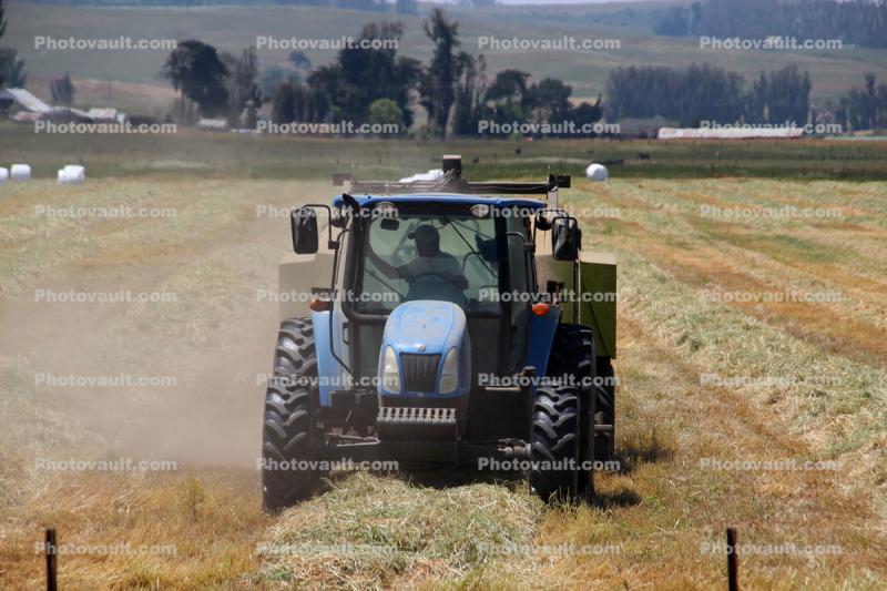 Tractor, baling hay, rolls, dust, dusty