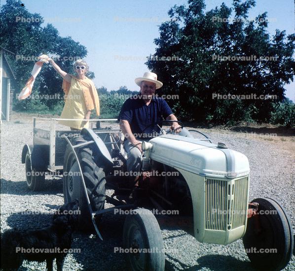 Woman and Man on old Tractor, 1950s