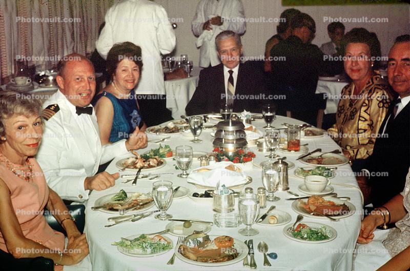 Formal Dinner, Ships Captain, Captains Table, Cooked food, meat, steak, men, women, formal attire, 1950s
