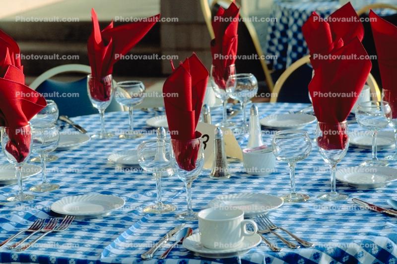 Coffee cups, plates, tablecloth, Wine Glasses, Napkins, table setting