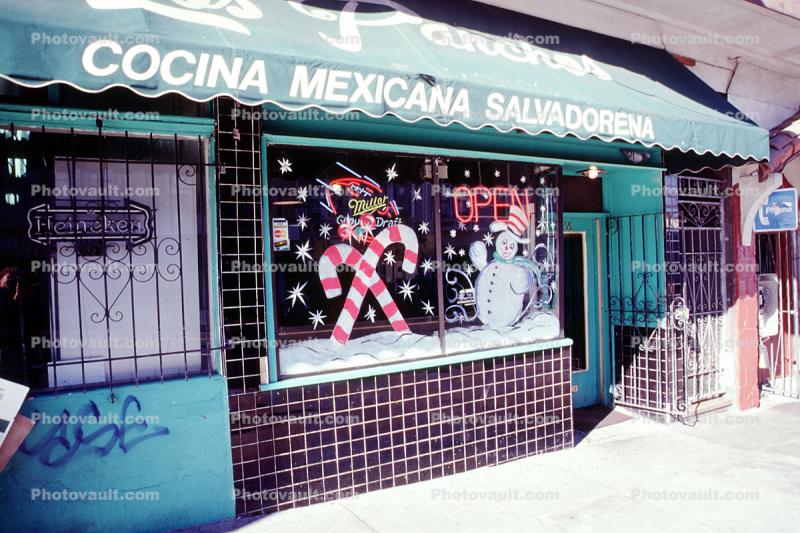 Cocina Mexicana Slvadorena, candy canes, snowman, open neon sign, awning, building