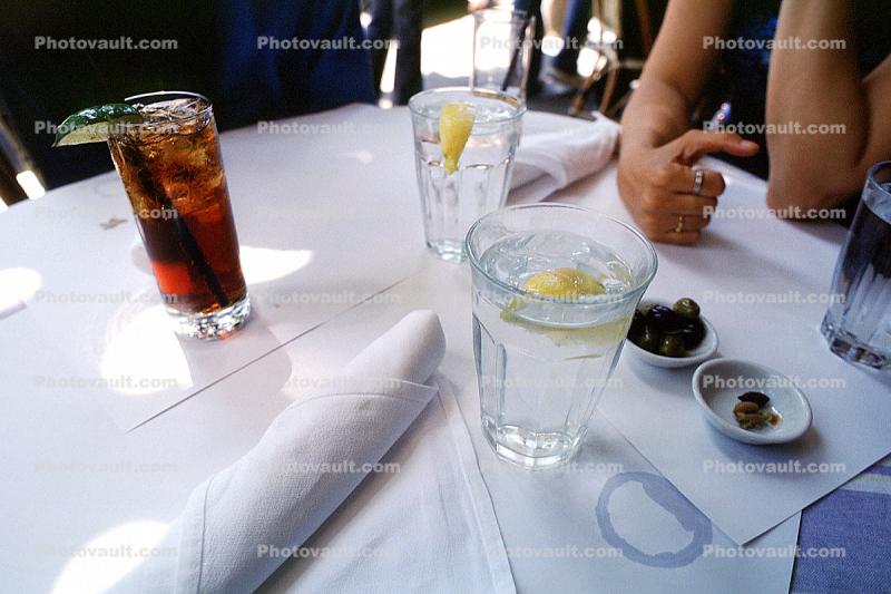 water, coke, Lime, lemon, Olives, tablecloth