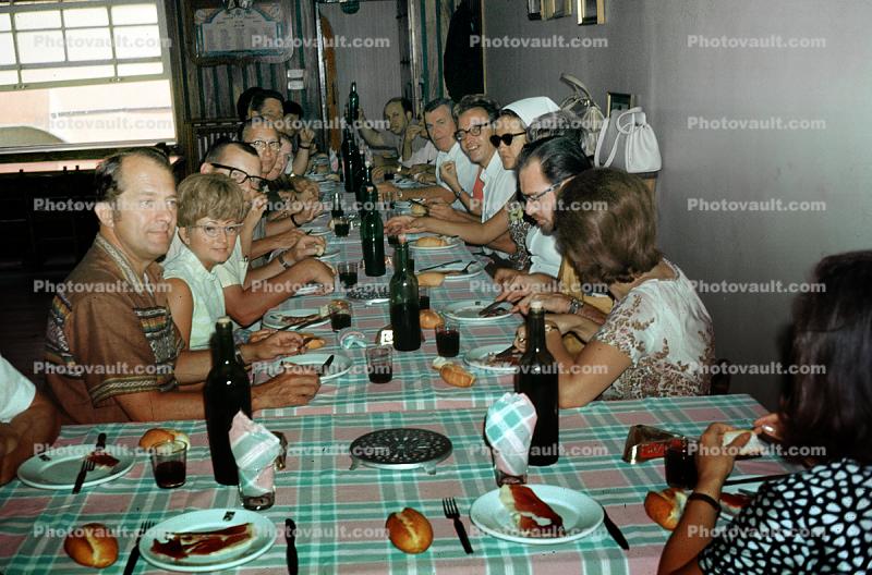 Tour Group Lunch. Women, Men, couples, Mouth full, Table Cloth