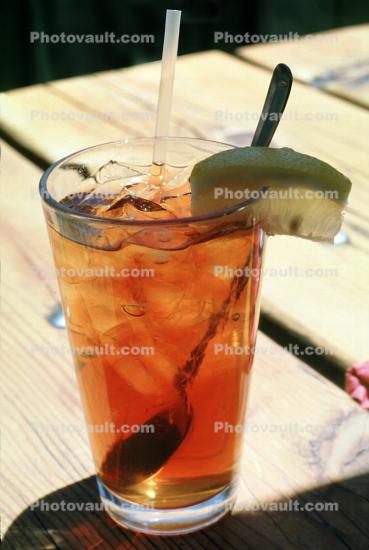 Iced Tea in a Glass, Ice, straw, lemon wedge, spoon