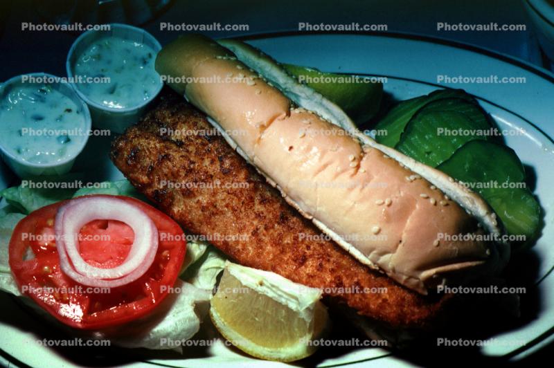 fried fish sandwich, Tomato and Onion, Lemon, seafood, lemon slice, onion, plate