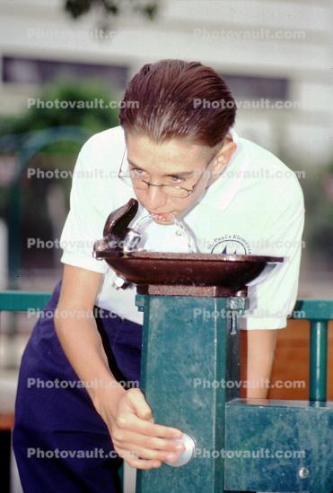 Boy drinking from a Water Fountain, aquatics