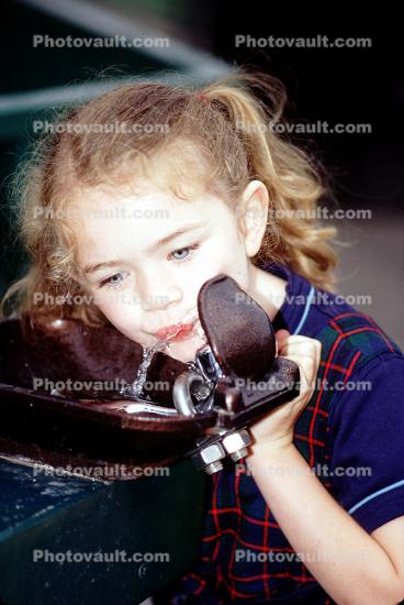 Girl drinking from a Water Fountain, aquatics