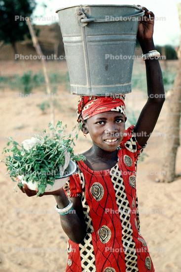 Girl Carrying Water and Plants, Dori