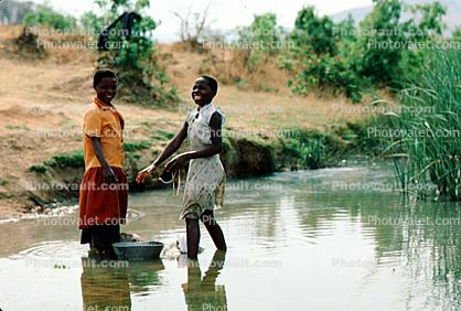Girls Washing Clothes in the River, smiling, smiles