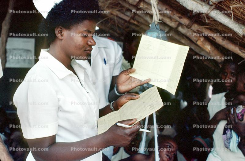 Nurse, Weighing a Toddler, Rushinga Zimbabwe