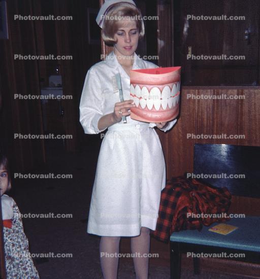 Dental Nurse domonstrating teeth care, Dentist, 1960s