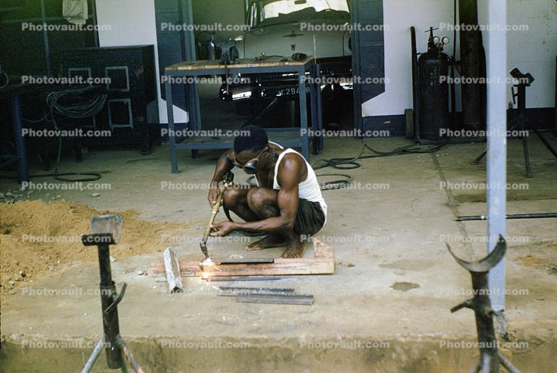 Man Welding, Water Pipeline Construction, Zaire, Africa, 1958, 1950s