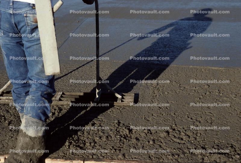 smoothing out cement for a large floor