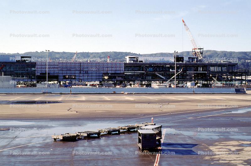 Airport Construction, baggage carts, crane, buildings, terminal