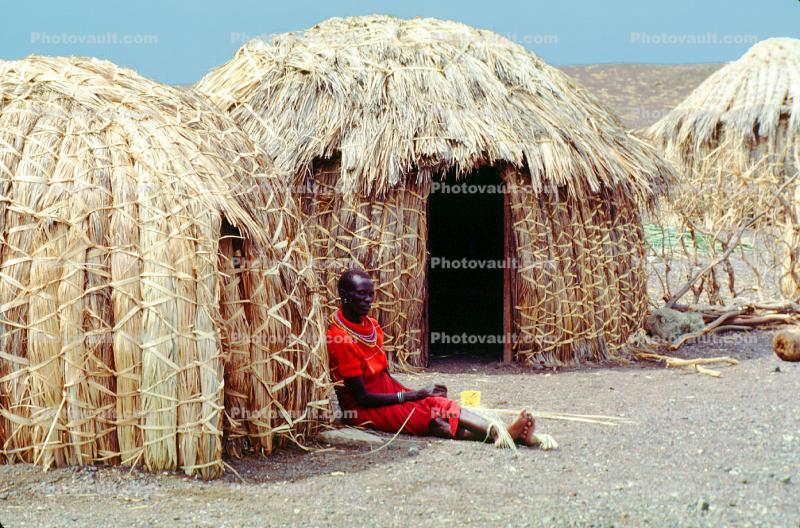 Grass Huts, woman thatching grass, Lake Turkana, Kenya, Sod