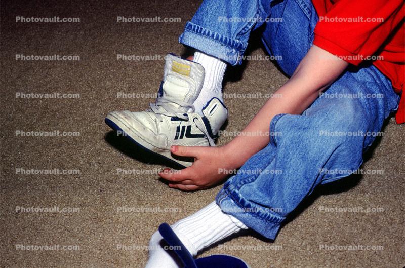 Boy Tying his shoes, shoestring