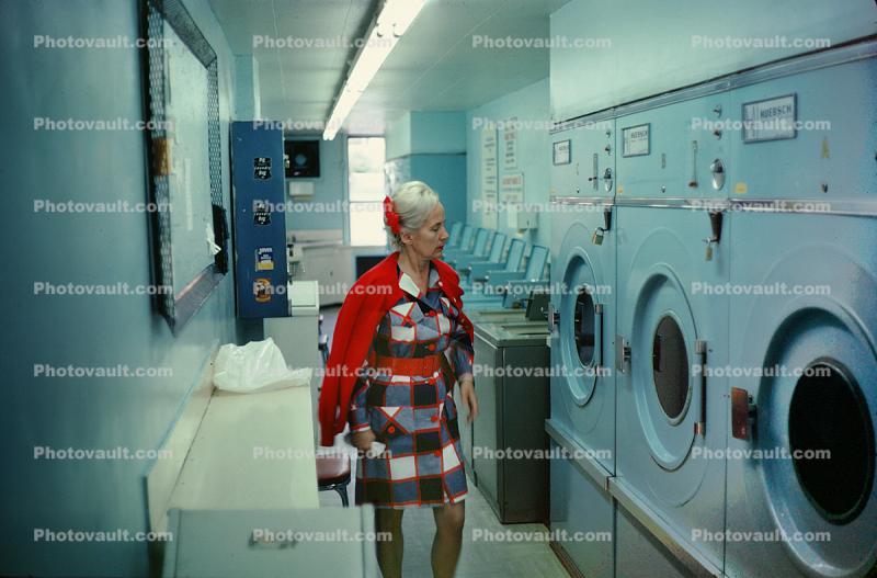 Woman at the laundromat, washing machines, historic, mod dress, 1960s