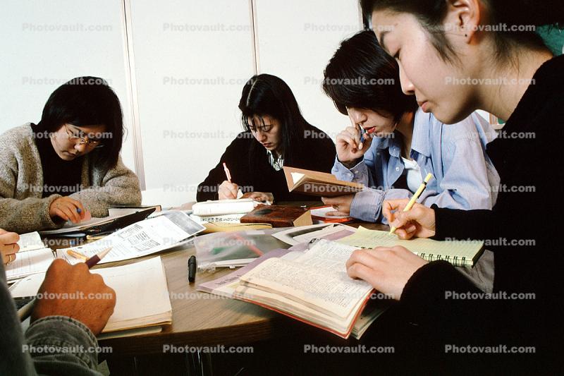 Man, Woman, studying, classroom, chalkboard, books