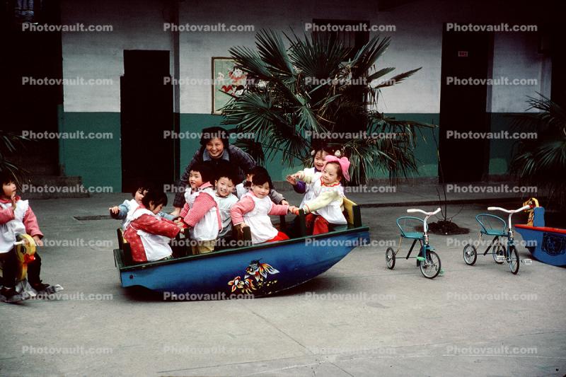 Rocking the boat, Teeter-totter, Tricycle, Girls, Boys, Wuxi, Shiangsi, China, 1950s