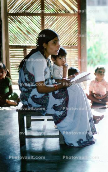 Teacher Reading, boy, sari
