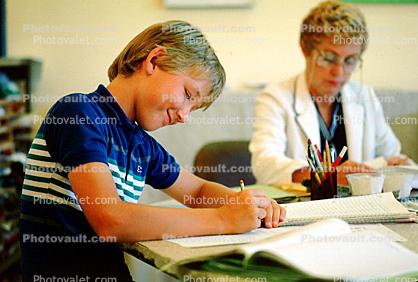 Boy Writing, Classroom, smiles