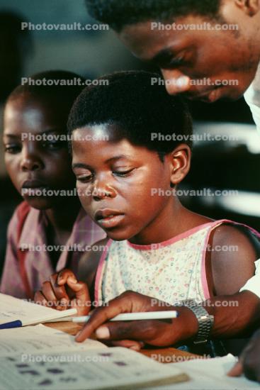 Girl learning to read, Reading, Teacher, Madzongwe