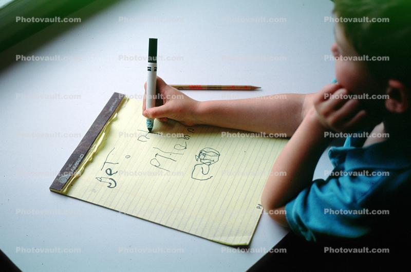 Boy learning to write