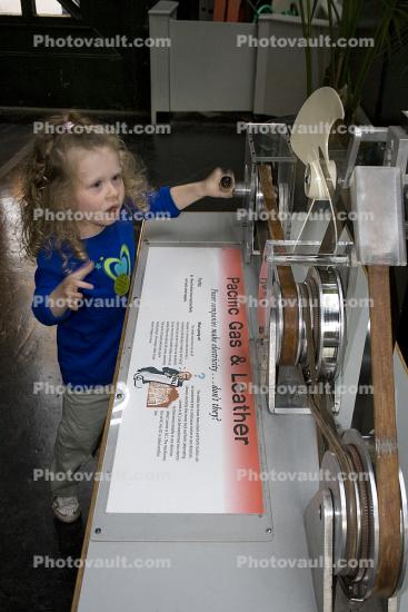 Girl playing with Static Electricity, hands-on exhibit, touch